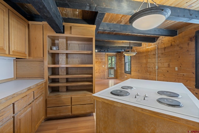 kitchen featuring beam ceiling, light hardwood / wood-style flooring, wood walls, pendant lighting, and wood ceiling