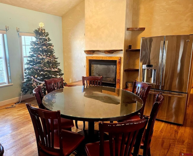 dining area with light hardwood / wood-style floors