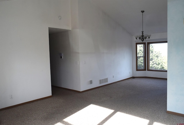 unfurnished room featuring carpet, high vaulted ceiling, and an inviting chandelier