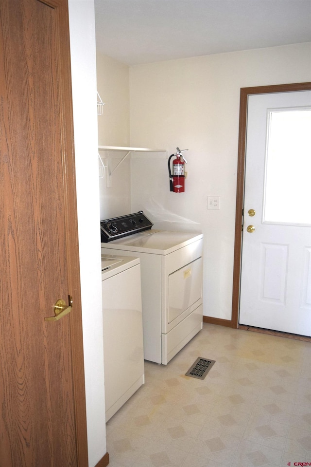 laundry area featuring independent washer and dryer