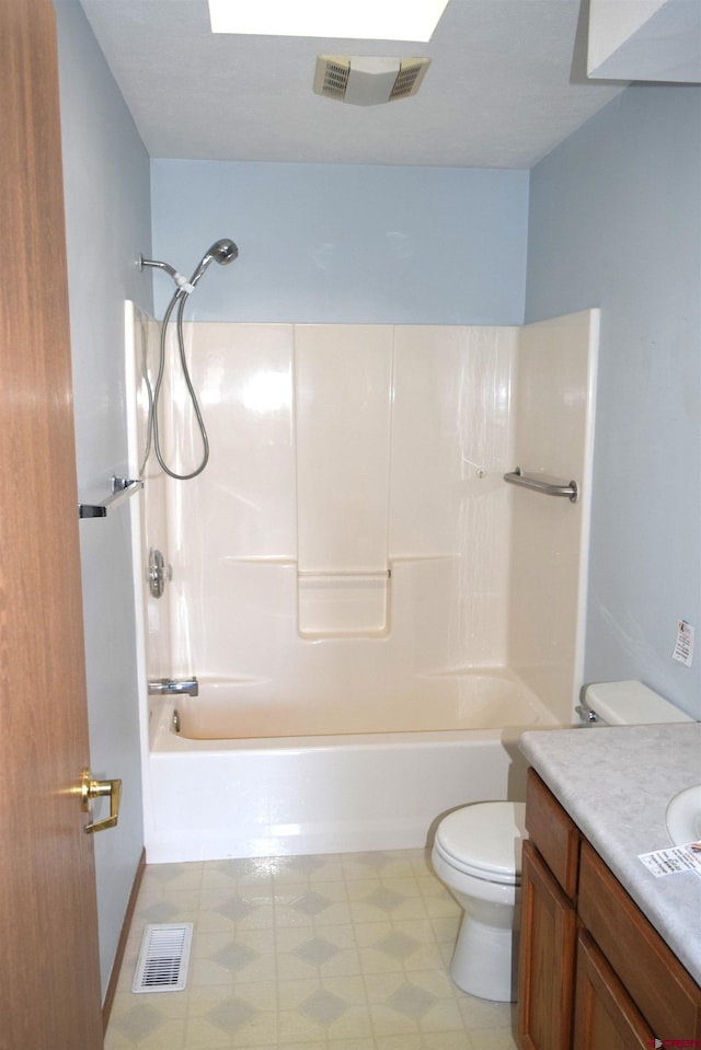 full bathroom featuring toilet, vanity, and bathing tub / shower combination