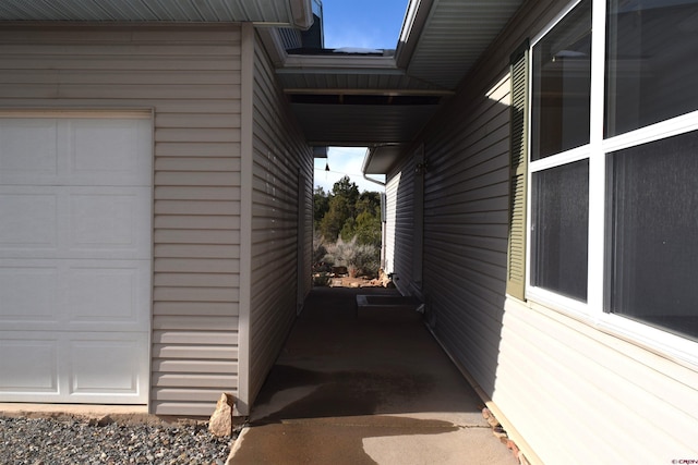 view of side of home with a garage