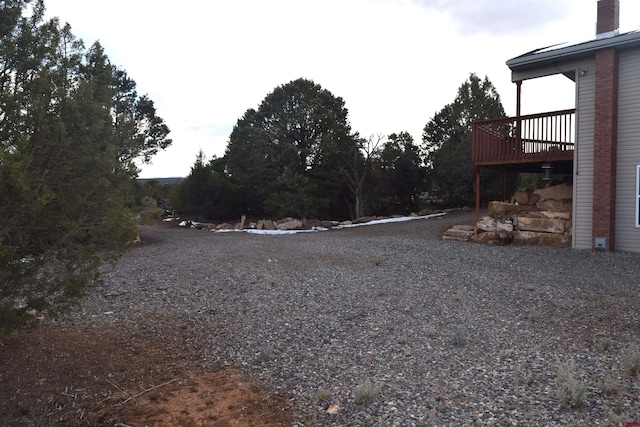 view of yard featuring a wooden deck