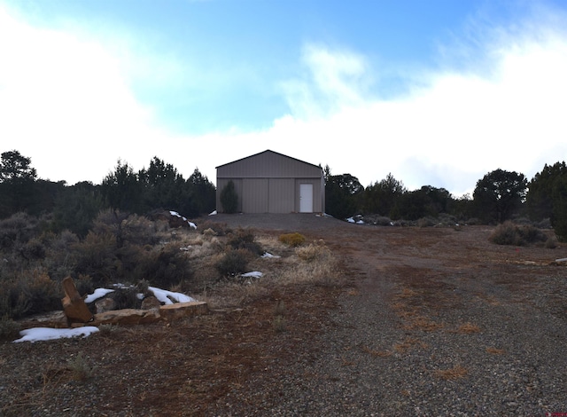 exterior space featuring an outbuilding and a garage