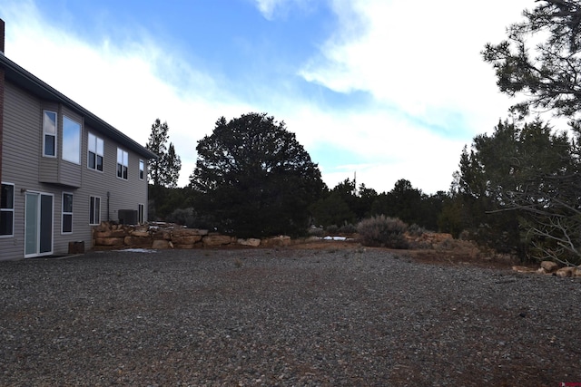 view of yard with central AC unit