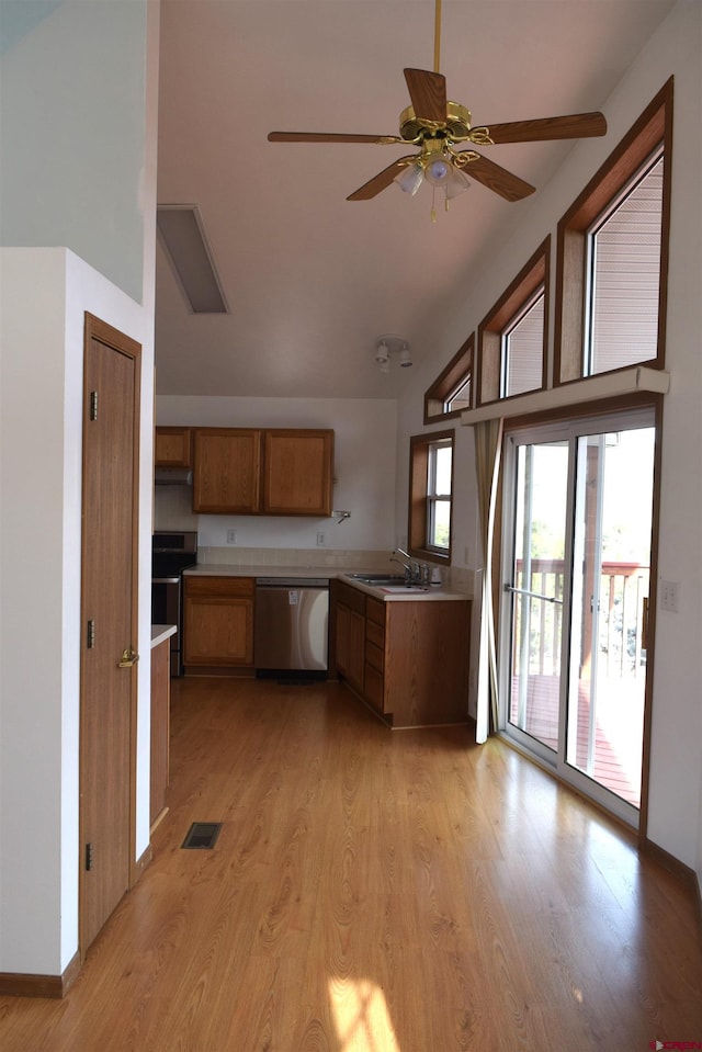 kitchen with dishwasher, sink, ceiling fan, range with electric stovetop, and light hardwood / wood-style floors