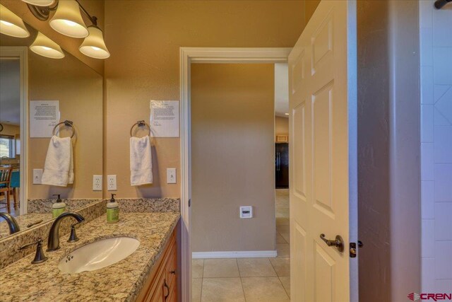 bathroom featuring tile patterned flooring and vanity