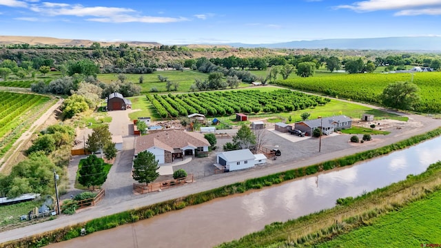 bird's eye view with a rural view and a water and mountain view