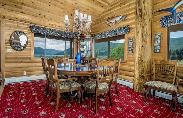 dining area featuring a mountain view, a healthy amount of sunlight, high vaulted ceiling, and a chandelier