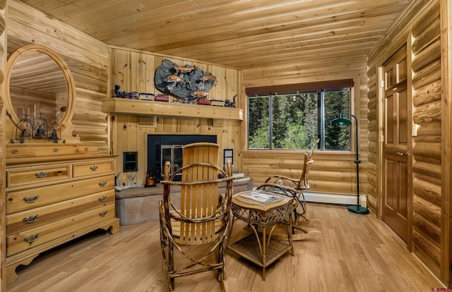 living area featuring wooden walls, light hardwood / wood-style flooring, and wooden ceiling