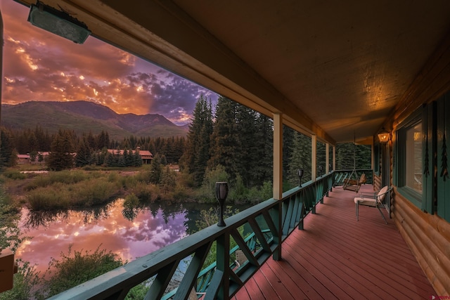 deck at dusk with a mountain view