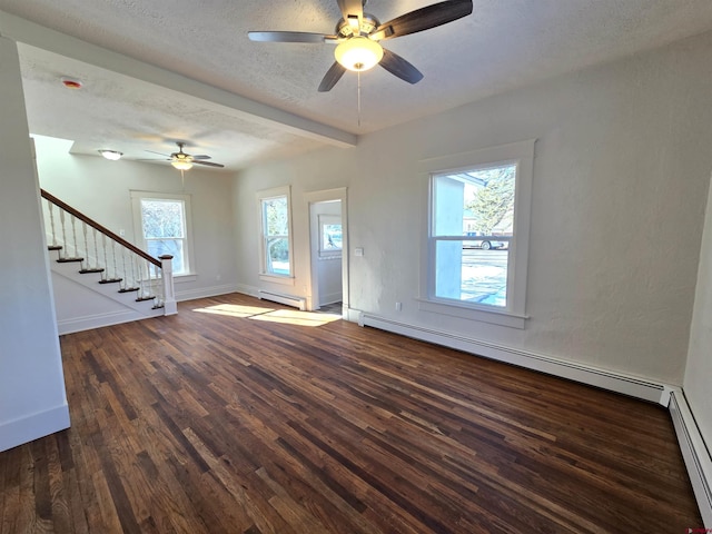 interior space featuring plenty of natural light, dark wood-type flooring, and a baseboard radiator