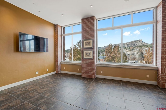 tiled empty room with a mountain view