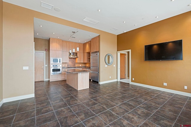 kitchen with a center island, light brown cabinets, backsplash, ventilation hood, and stainless steel appliances