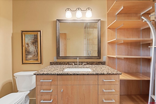 bathroom featuring hardwood / wood-style floors, vanity, and toilet