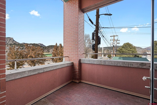 balcony featuring a mountain view