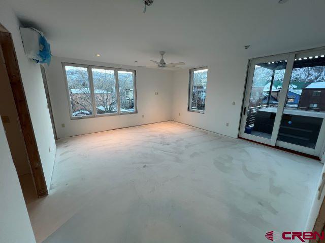 unfurnished room featuring ceiling fan