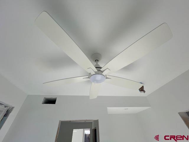 interior details featuring ceiling fan