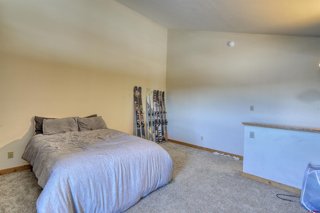 carpeted bedroom with vaulted ceiling