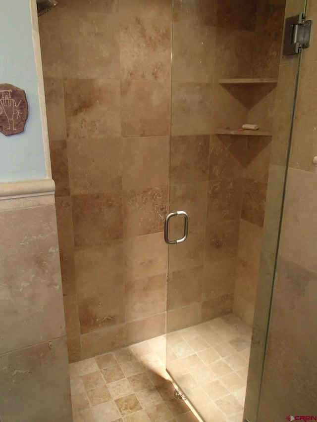 bathroom with a stall shower