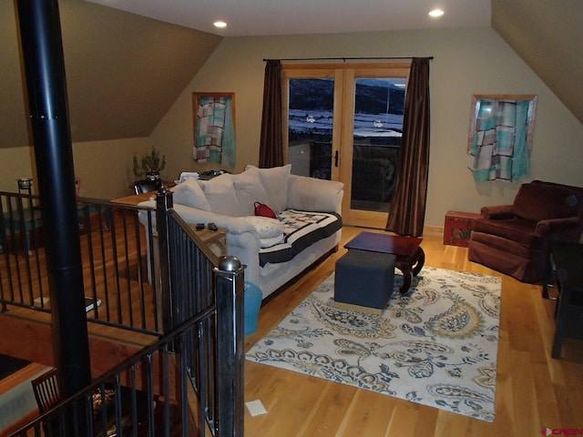 interior space featuring lofted ceiling, wood finished floors, and recessed lighting