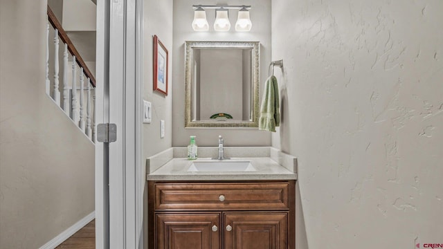 bathroom with wood-type flooring and vanity