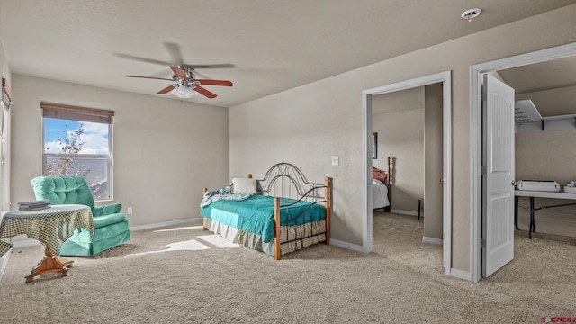 bedroom with ceiling fan and light carpet