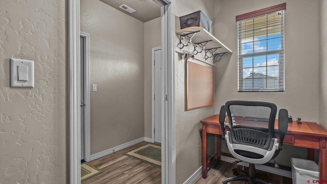 office space with wood-type flooring