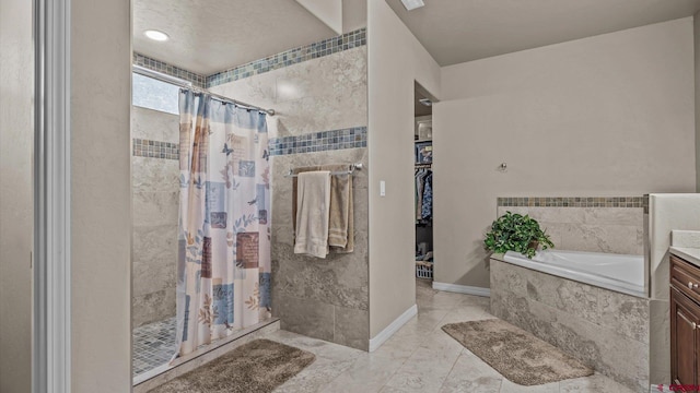 bathroom featuring vanity and plus walk in shower