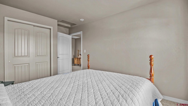 bedroom with carpet flooring and a closet