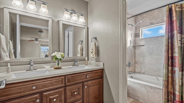 bathroom featuring vanity, shower / tub combo with curtain, and ceiling fan