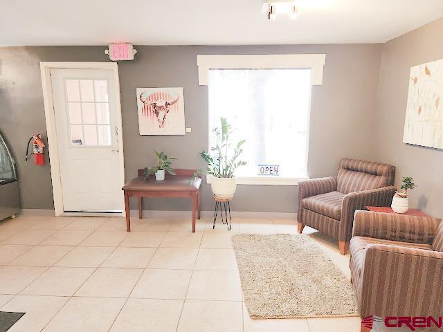 living area with light tile patterned floors