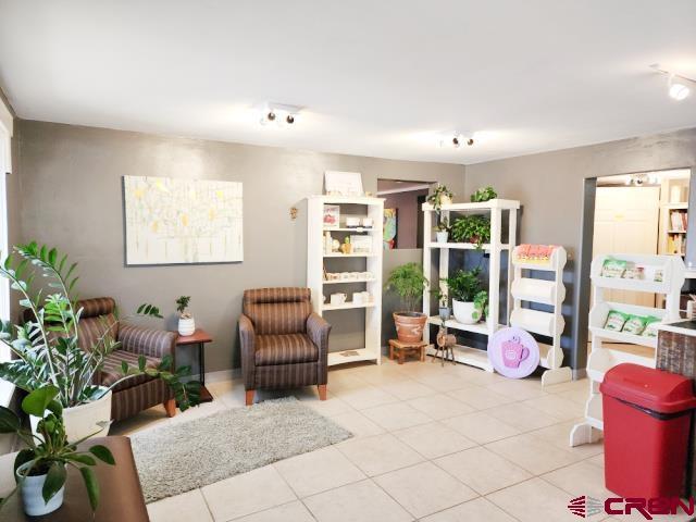 living area with light tile patterned flooring