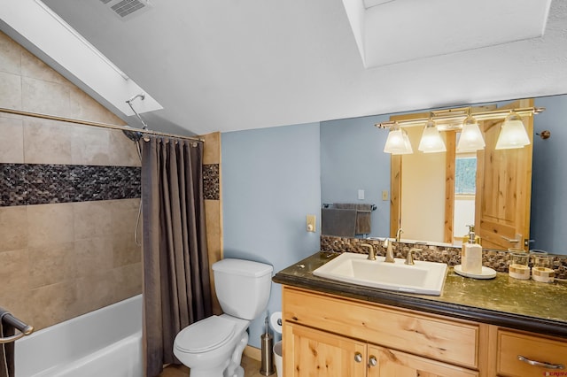 full bathroom with vaulted ceiling with skylight, vanity, toilet, and shower / tub combo with curtain