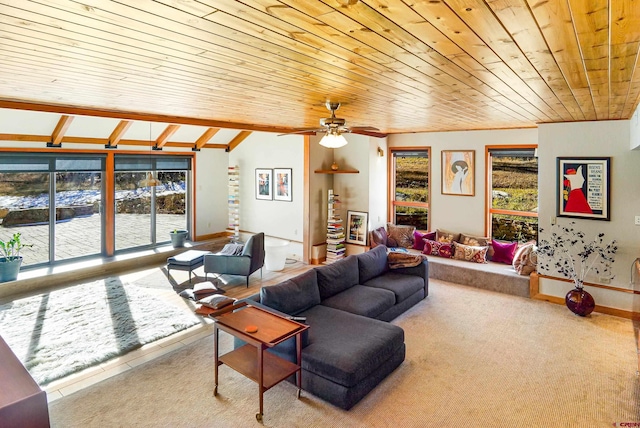 carpeted living room featuring vaulted ceiling with beams, ceiling fan, and wood ceiling