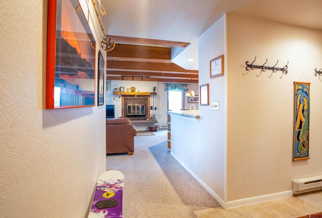 hall featuring baseboard heating, carpet floors, and beamed ceiling