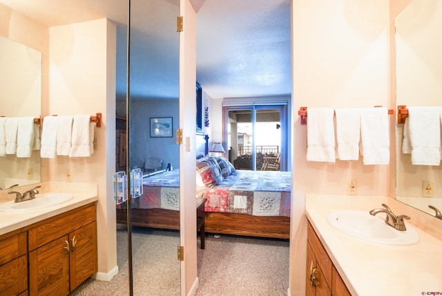 bathroom featuring a textured ceiling and vanity