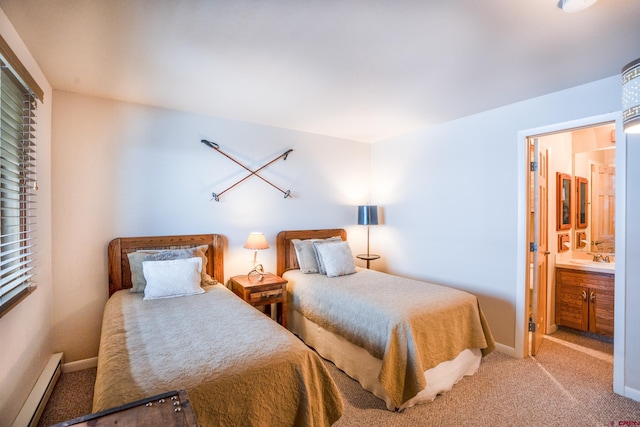 carpeted bedroom featuring connected bathroom and baseboard heating