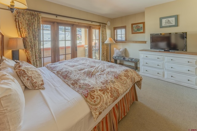 bedroom with light carpet, access to outside, and french doors