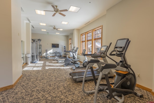 exercise room with ceiling fan and carpet floors