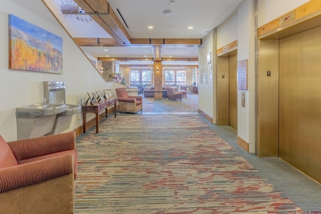 corridor with carpet floors, elevator, and french doors