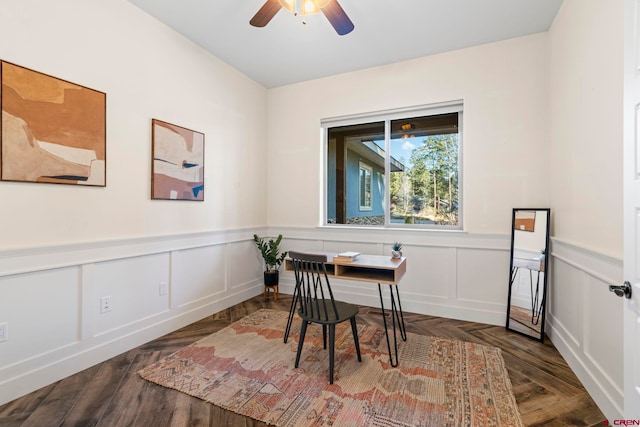 office space featuring dark hardwood / wood-style flooring and ceiling fan