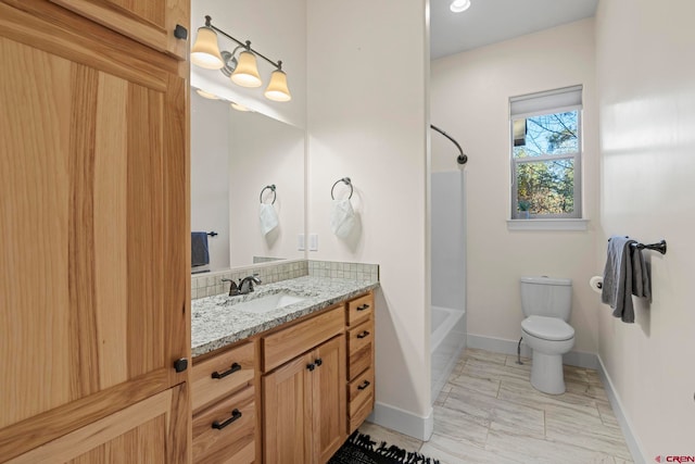 full bathroom with washtub / shower combination, vanity, and toilet