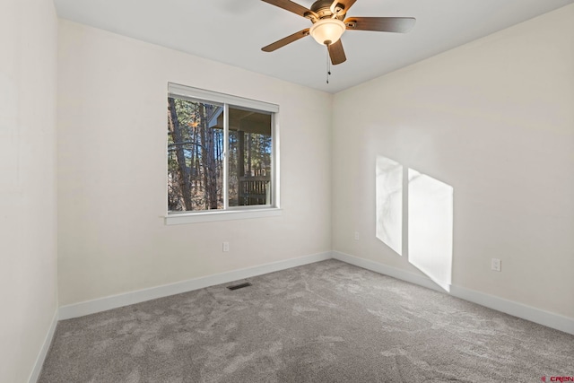 unfurnished room featuring carpet and ceiling fan