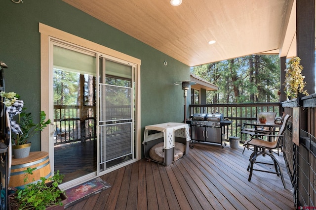 wooden terrace featuring area for grilling