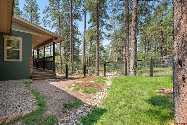 view of yard featuring a wooden deck