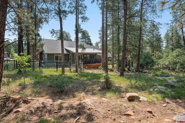 view of yard with a sunroom