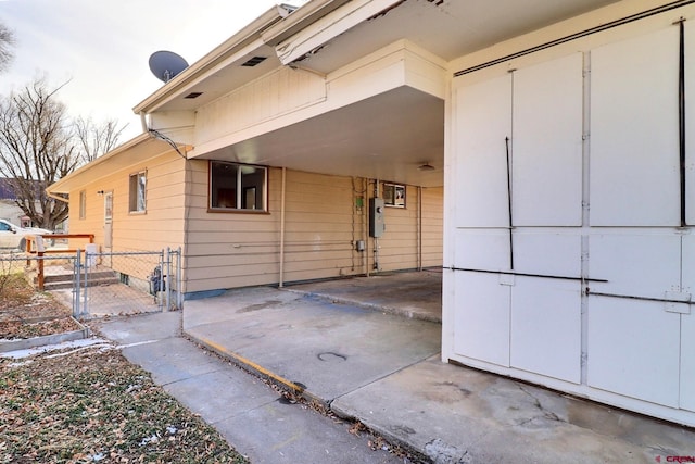 view of home's exterior featuring a carport