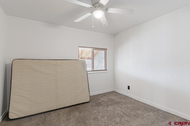 unfurnished bedroom with ceiling fan, a closet, and carpet floors