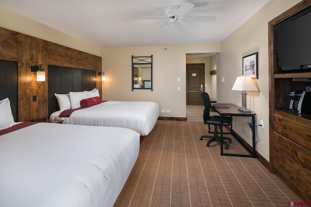 bedroom featuring wood-type flooring and ceiling fan